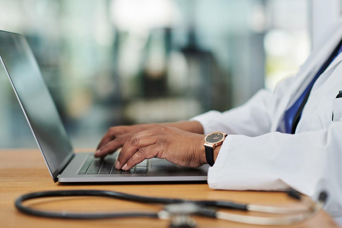 Hands on a laptop