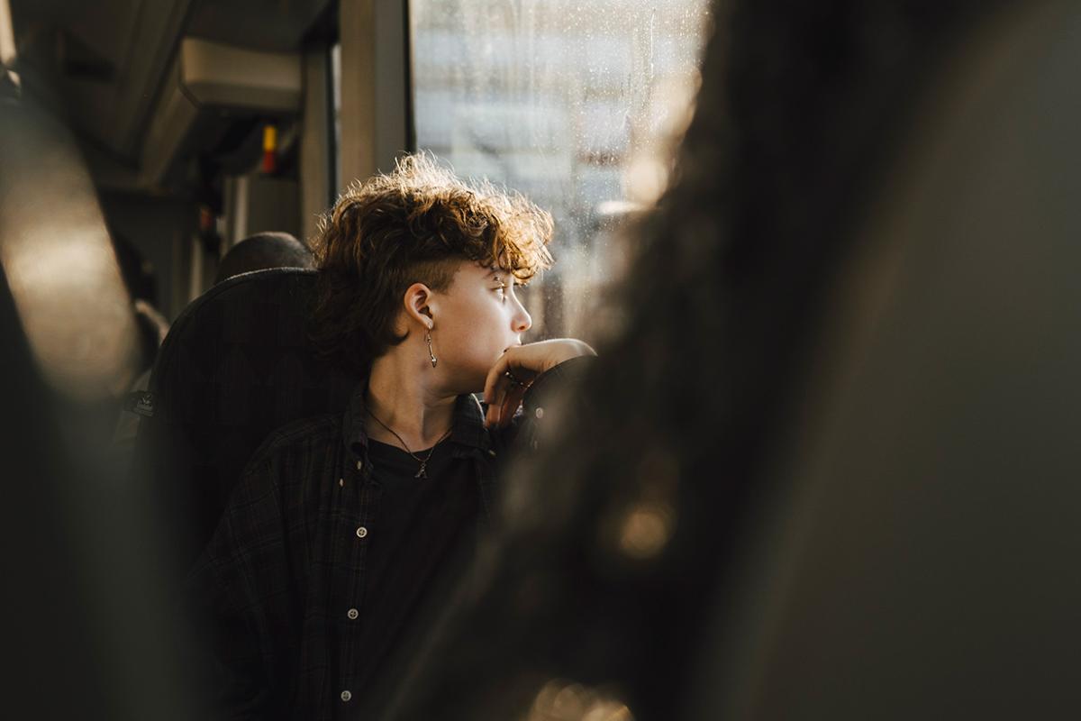 Person looking out a window