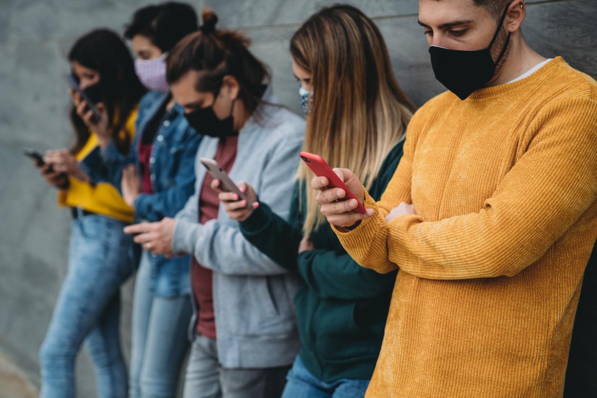 Group of people looking at smartphones