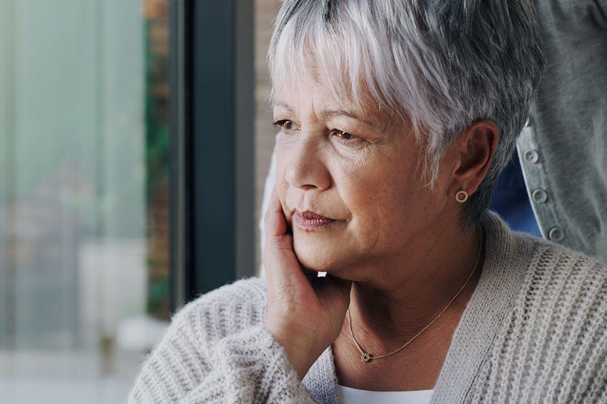 Person with chin resting on hand
