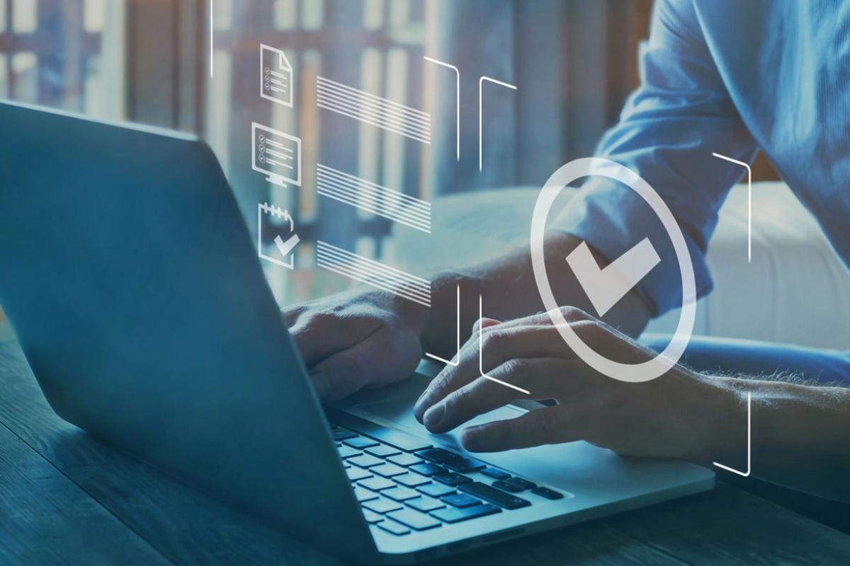 Hands on a laptop with inbox icons