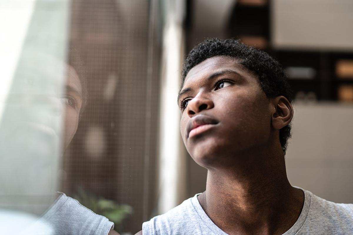Person looking out a window