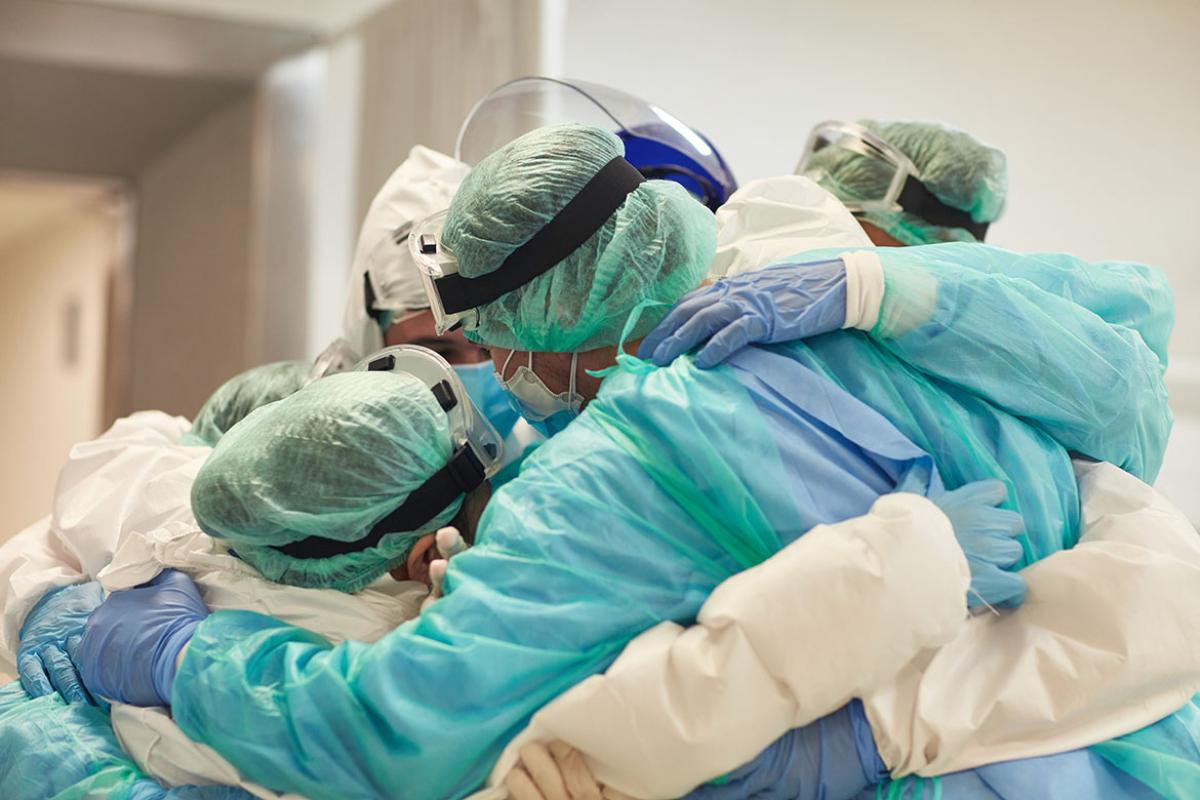 Group of health care workers in a huddle