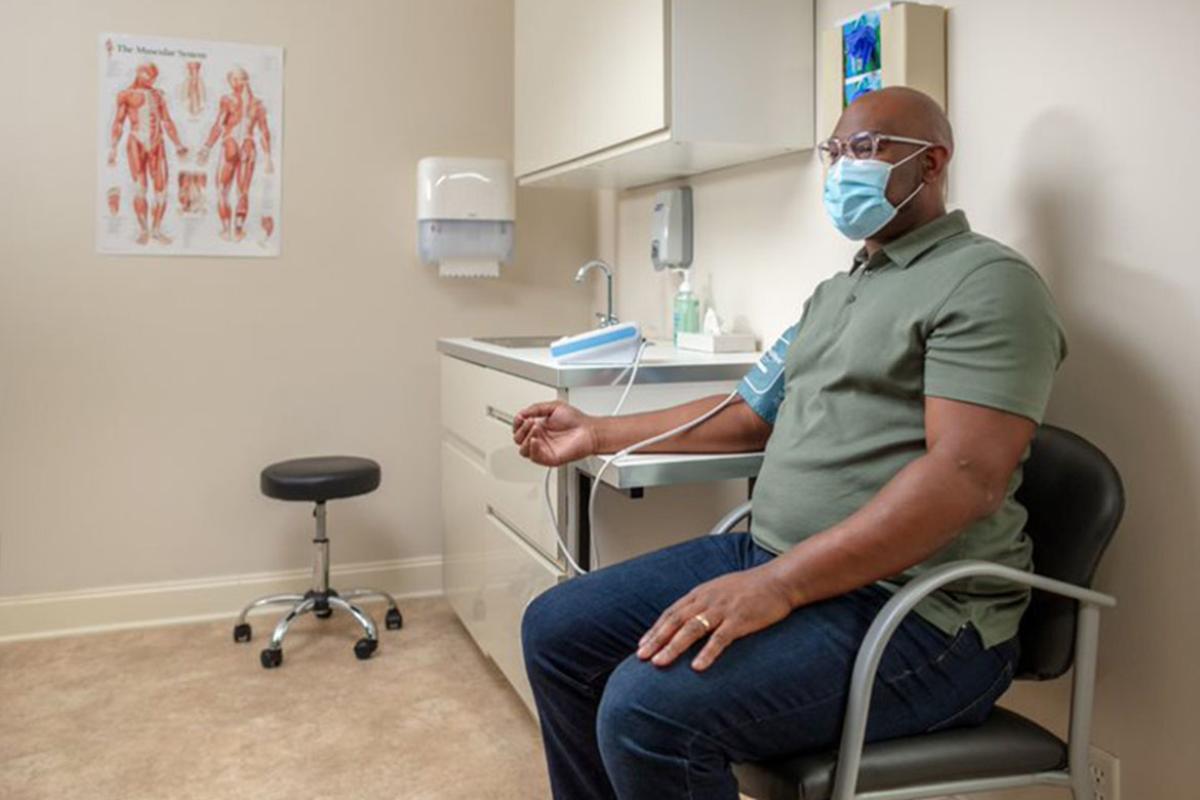 Patient having blood pressure measured