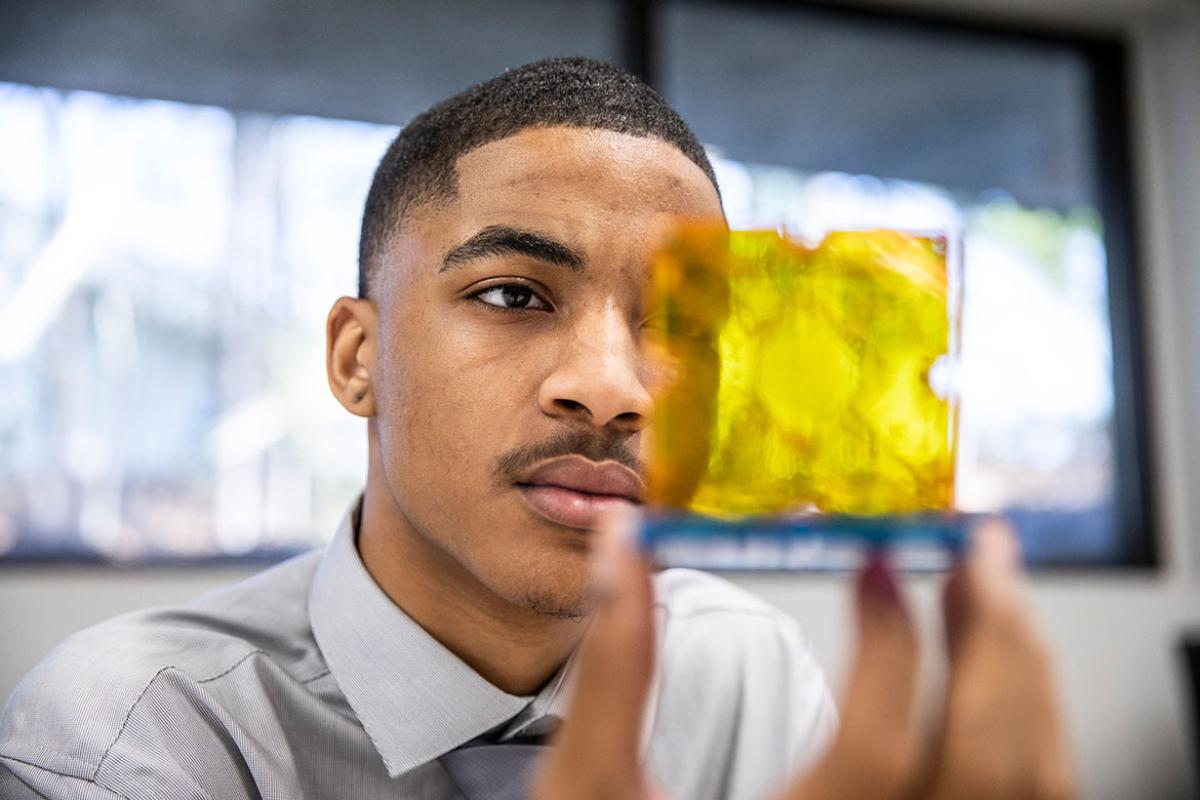 Person examining a prototype