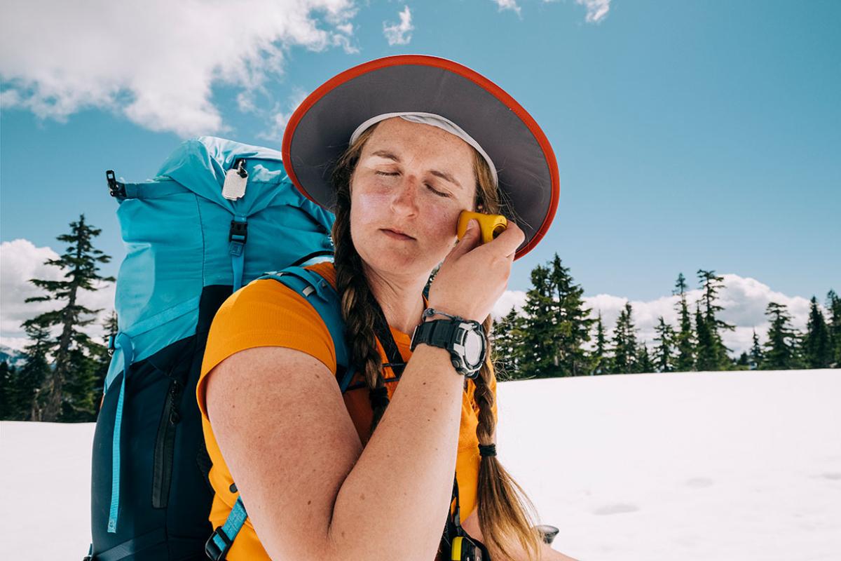 Person applying sunscreen