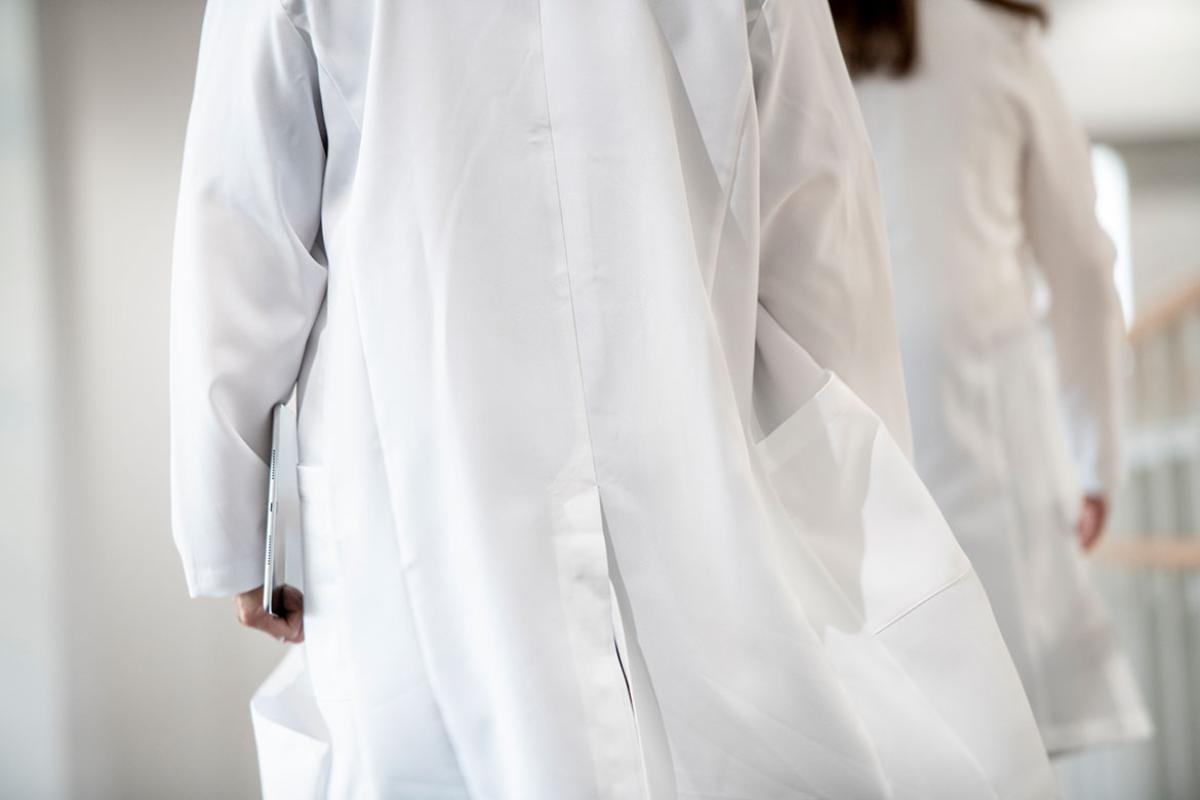Physician walking down a hallway