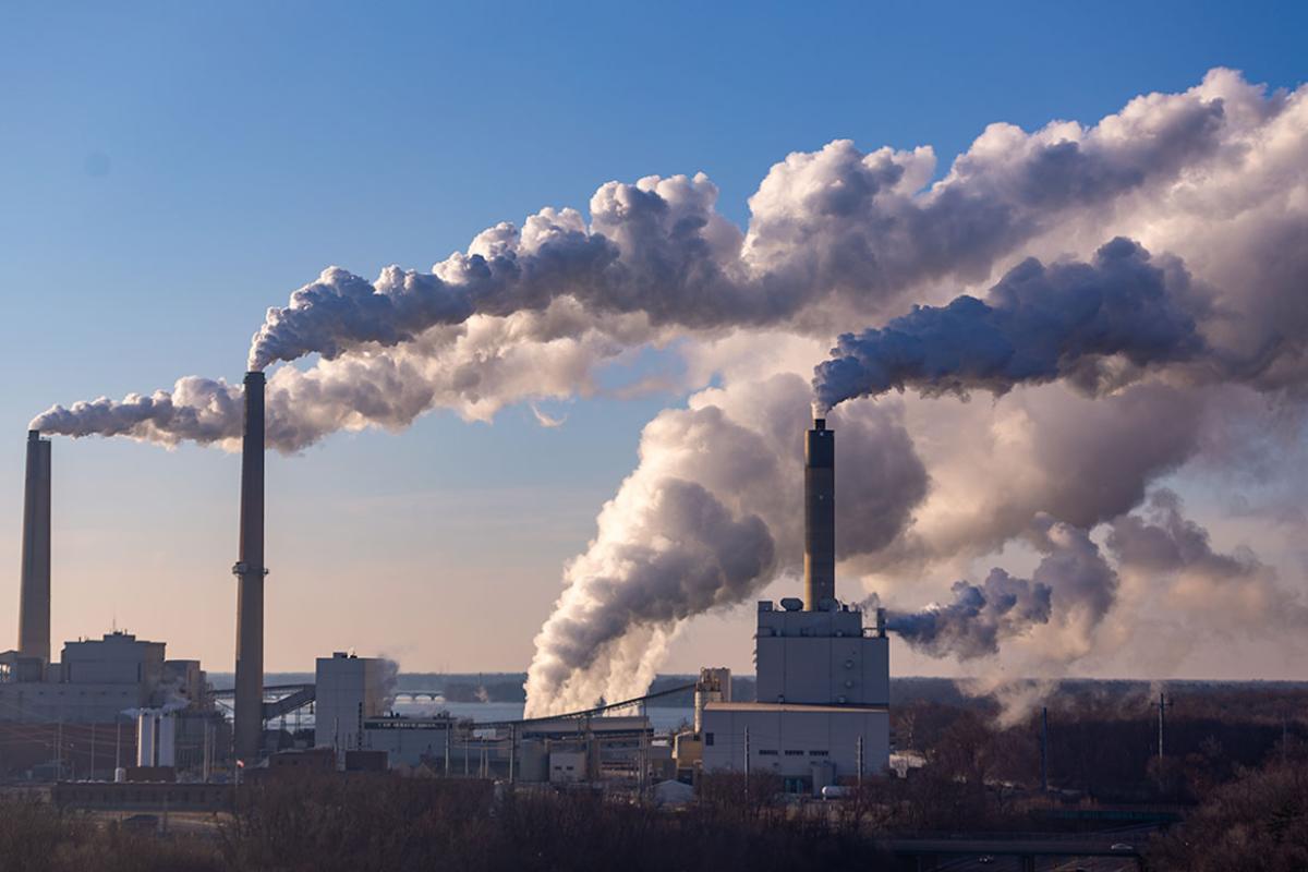 Wind blowing pollution from a coal burning power plant