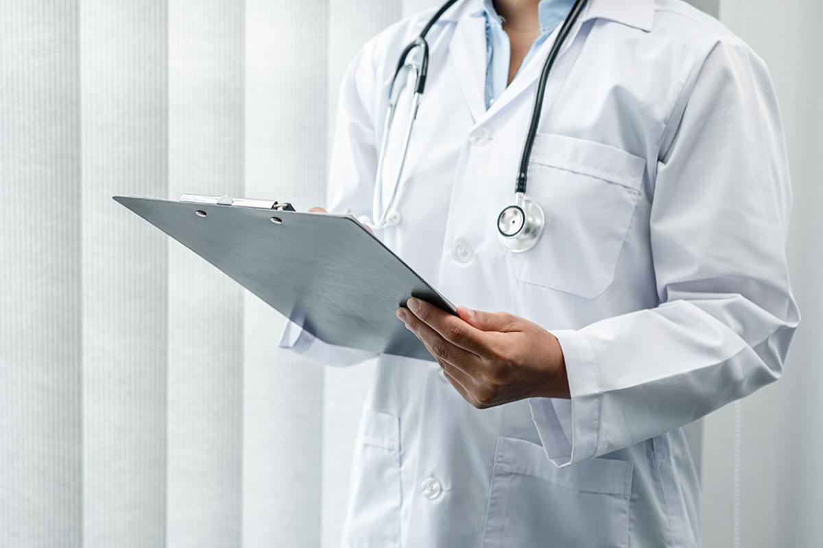 Physician holding a clipboard