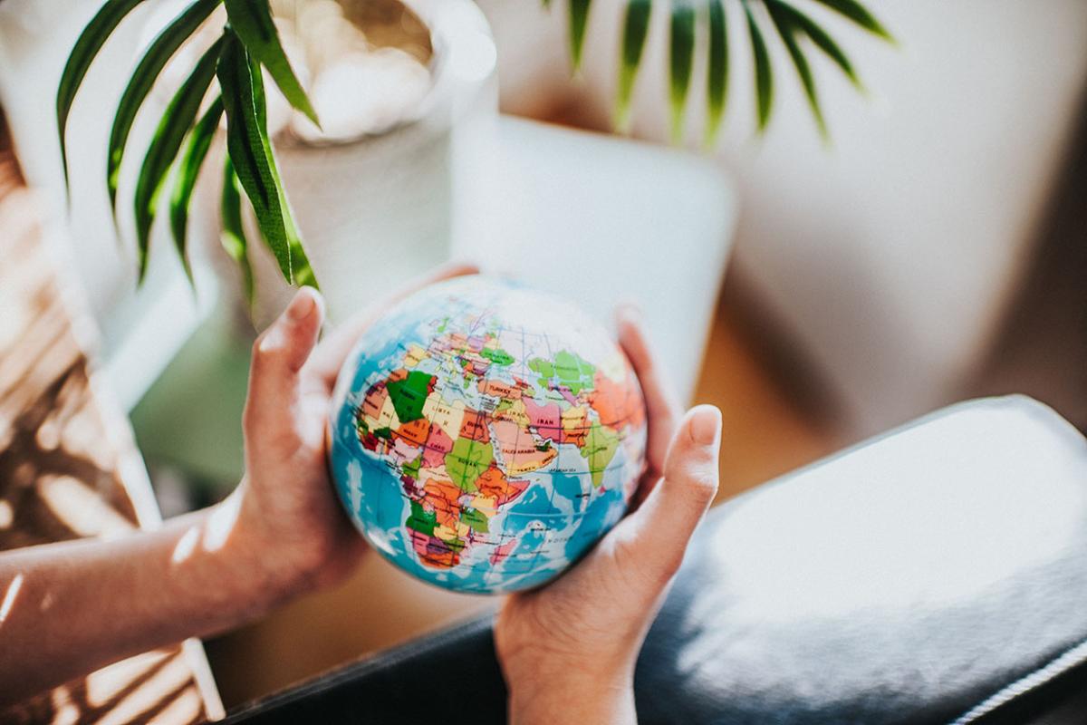 Hands holding a globe