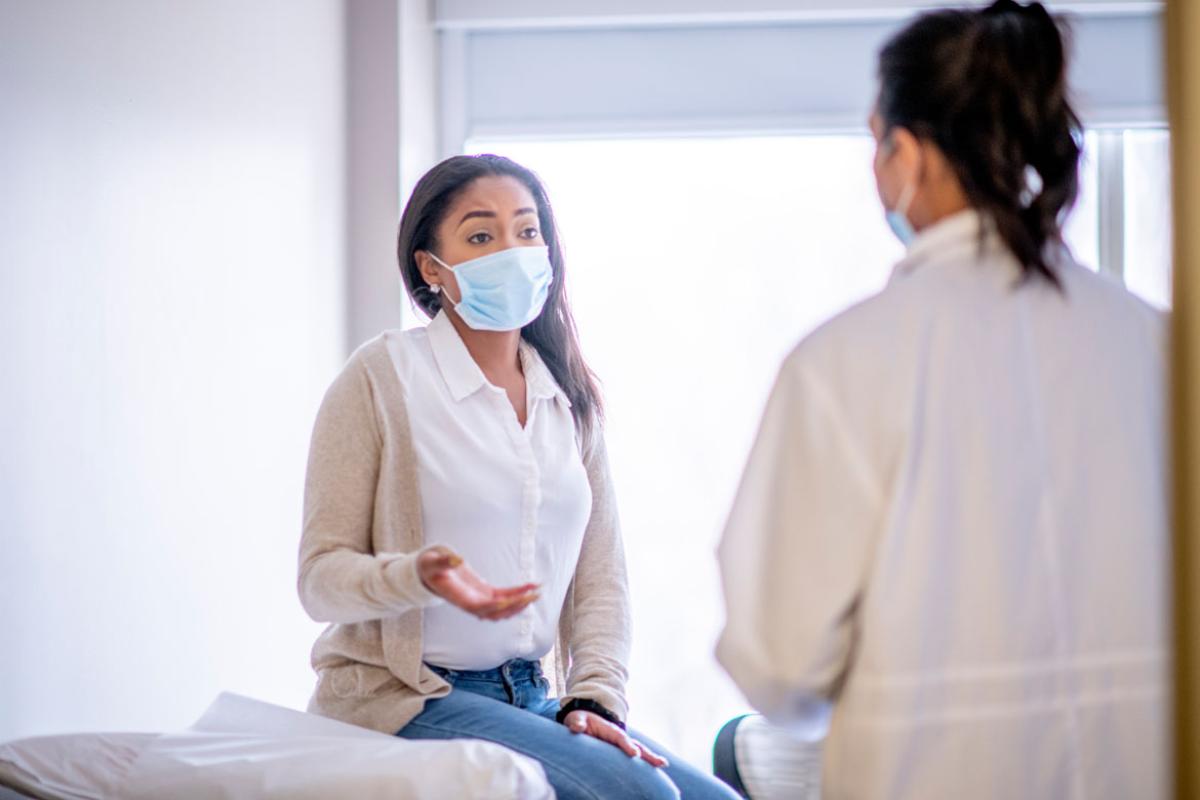 Physician and patient speaking