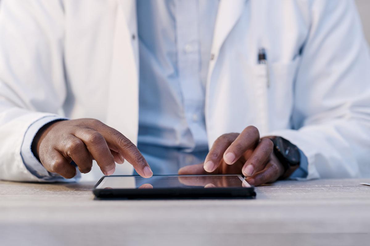 Hands scrolling on a tablet