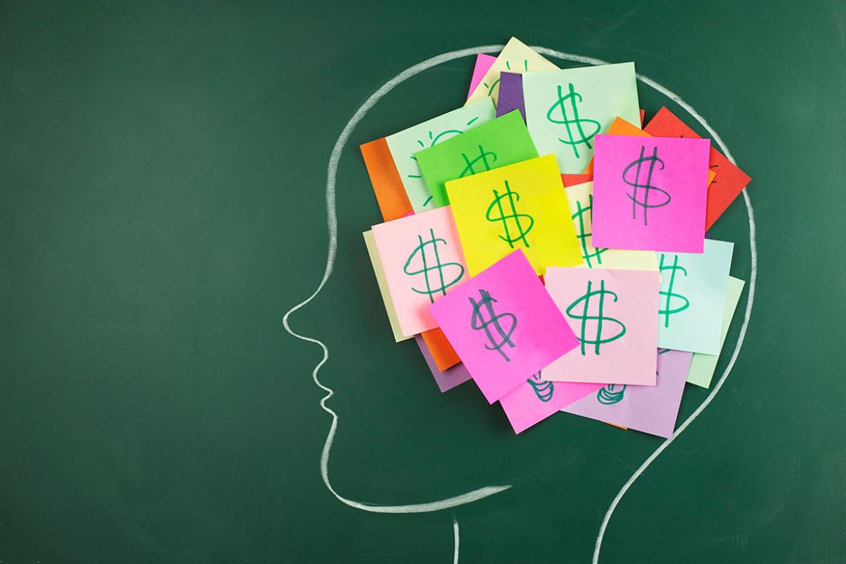Human profile with notes and dollar signs