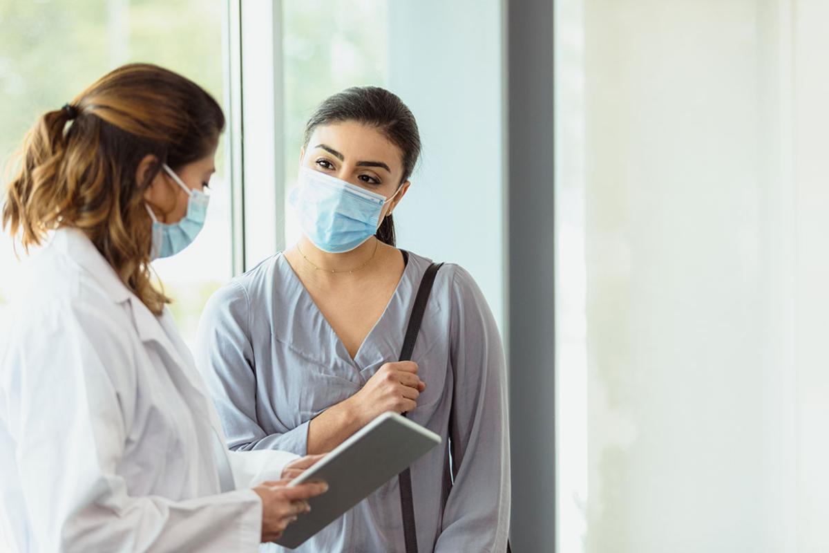 Physician speaking with patient