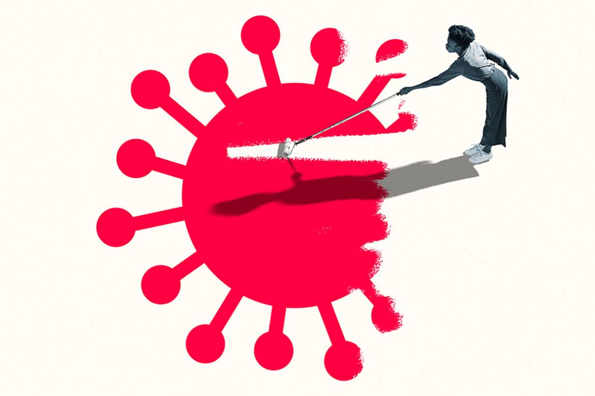 Person erasing COVID-19 virus with a paint roller