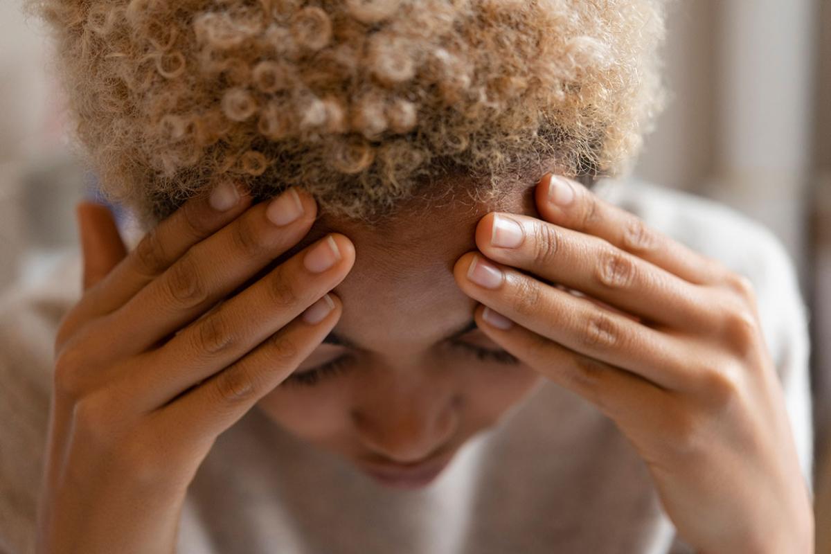 Woman suffering from migraine