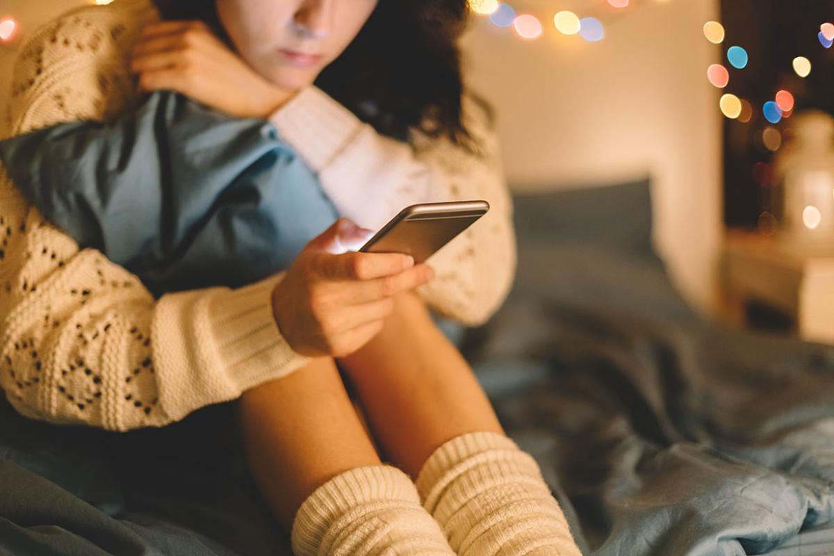 Young person looking at a smartphone