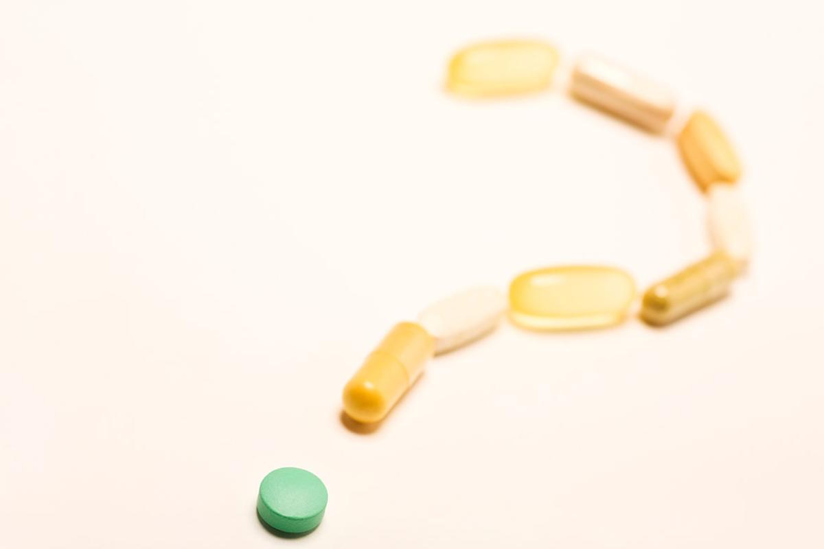 Supplements in the shape of a question mark