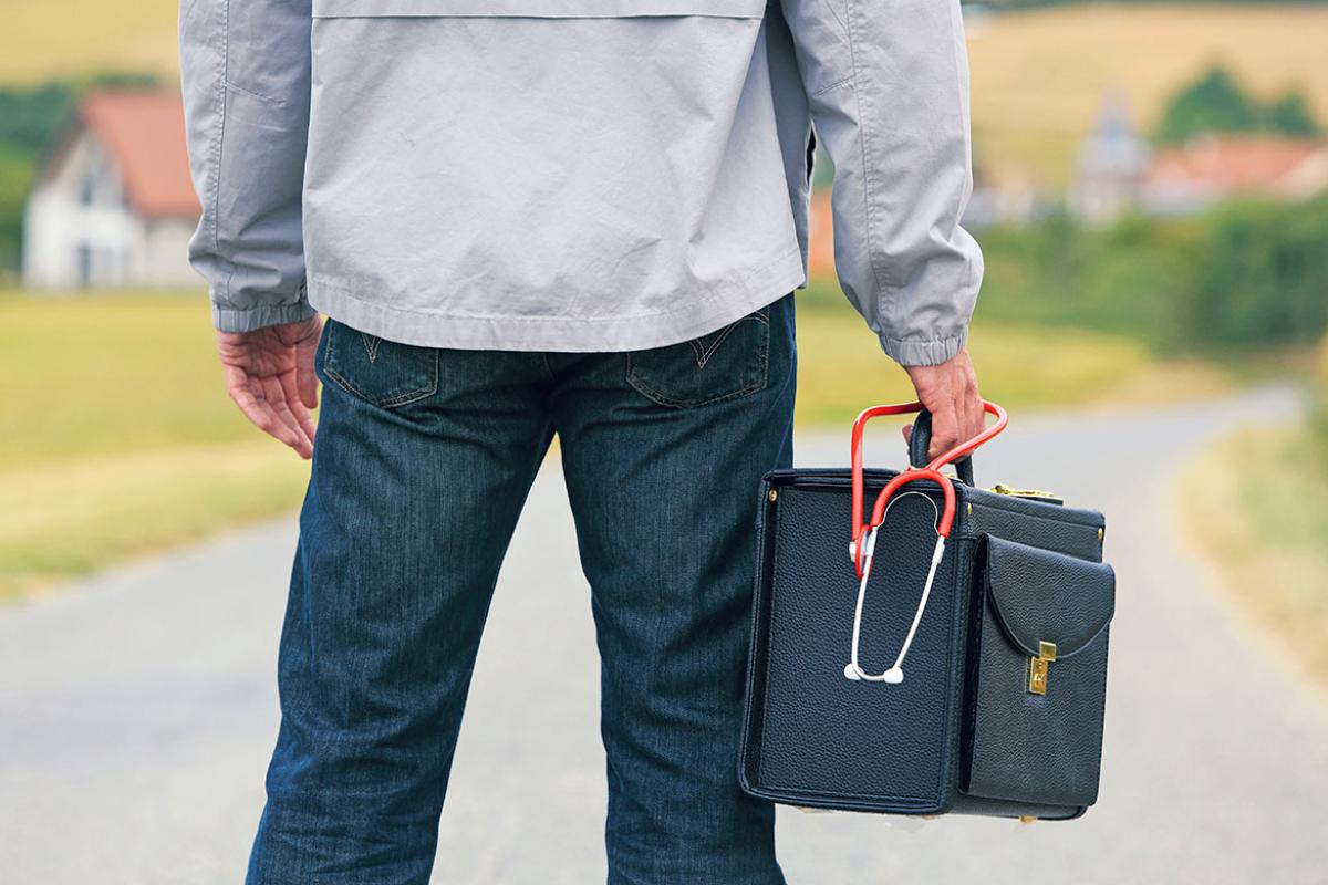 Person holding a carrying case with a stethoscope