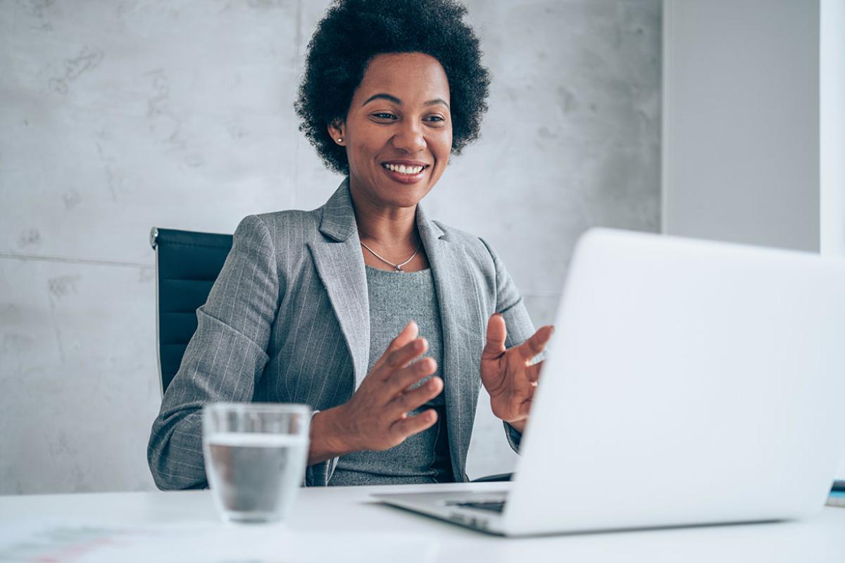 Smiling person having video call in an office