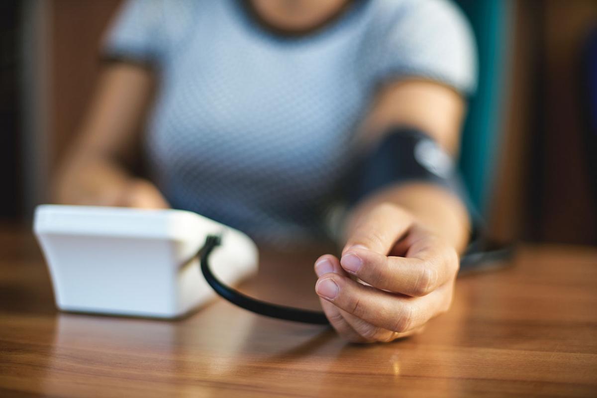 Arm with blood pressure cuff