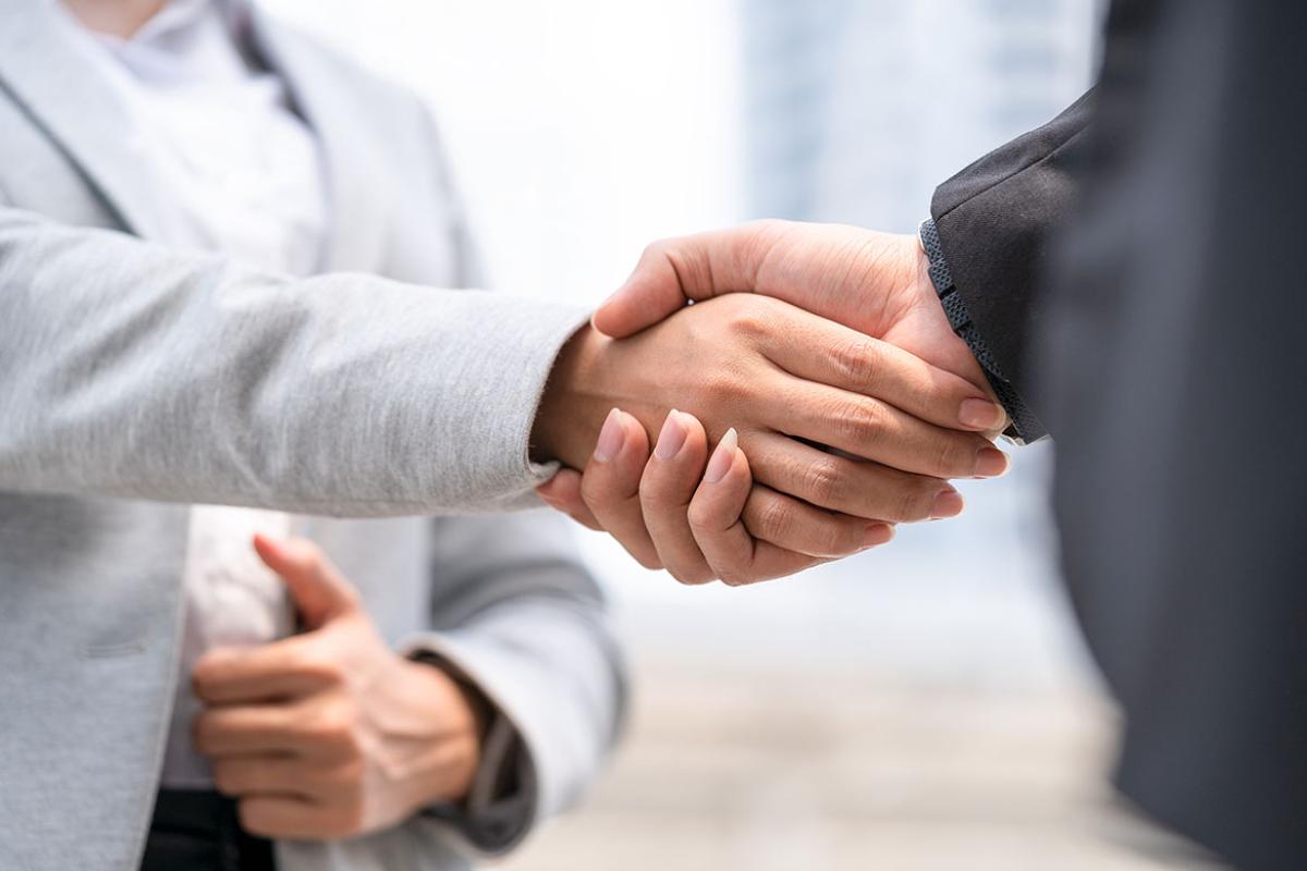 Two people shaking hands