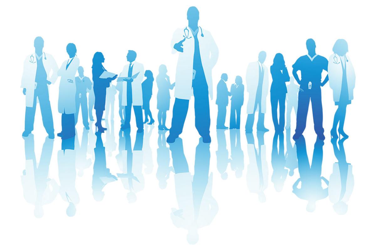  Silhouetted health care professionals with a central figure with hand outstretched
