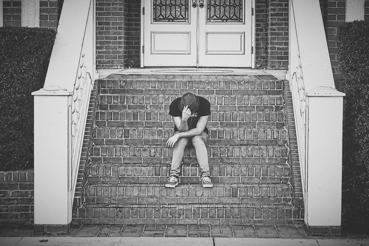 Person sitting on building steps