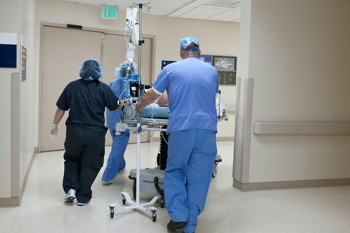 Patient being rushed through hospital corridor