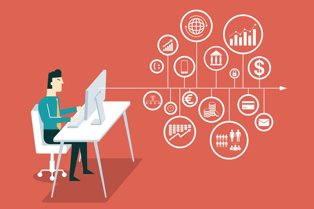 Person working at a desktop, surrounded by business icons