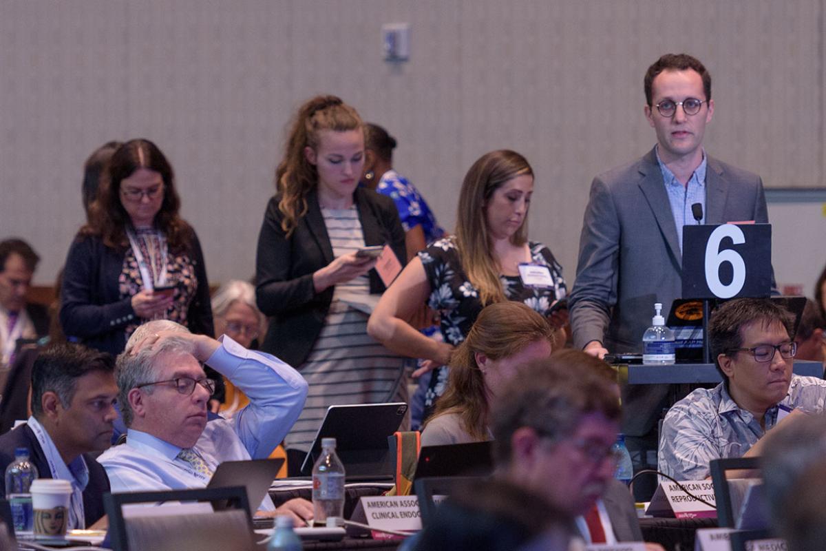 Delegates stand in line to speak at the 2022 Interim Meeting