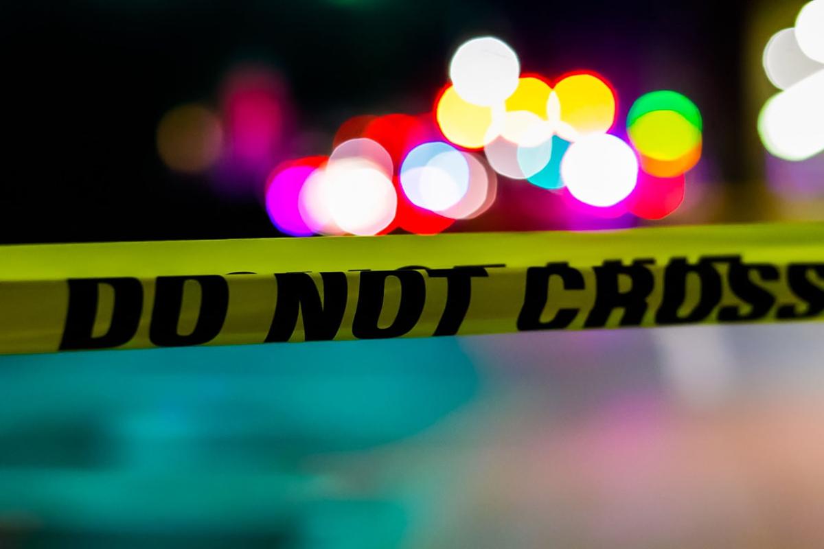 Crime scene tape with the words "do not cross"