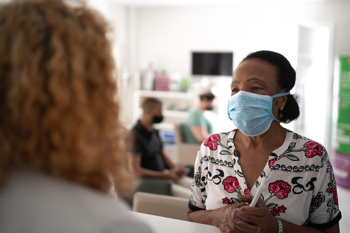 Patient speaking with health care worker