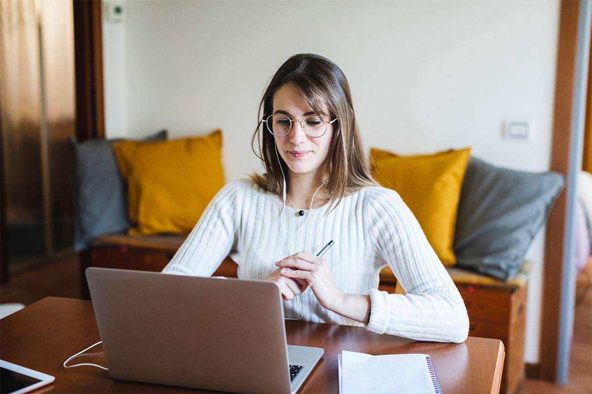 Person sitting in front of a laptop