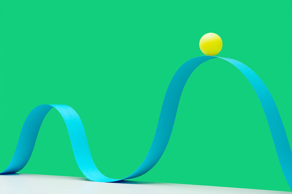 Ball on crest of wave pattern