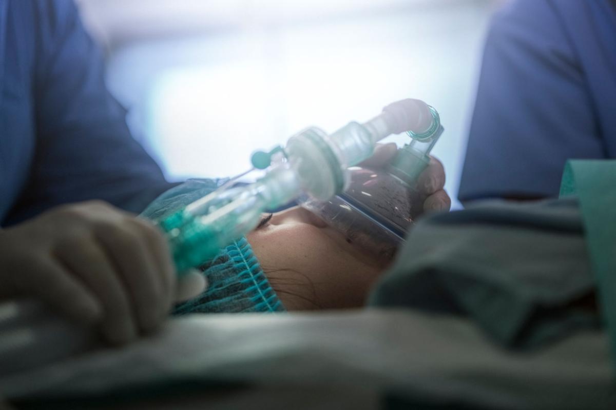 Young patient wearing oxygen mask
