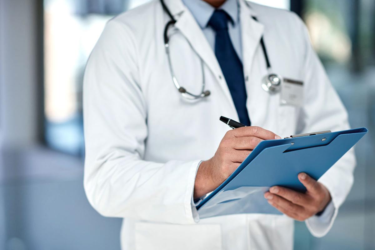 Physician holding patient chart
