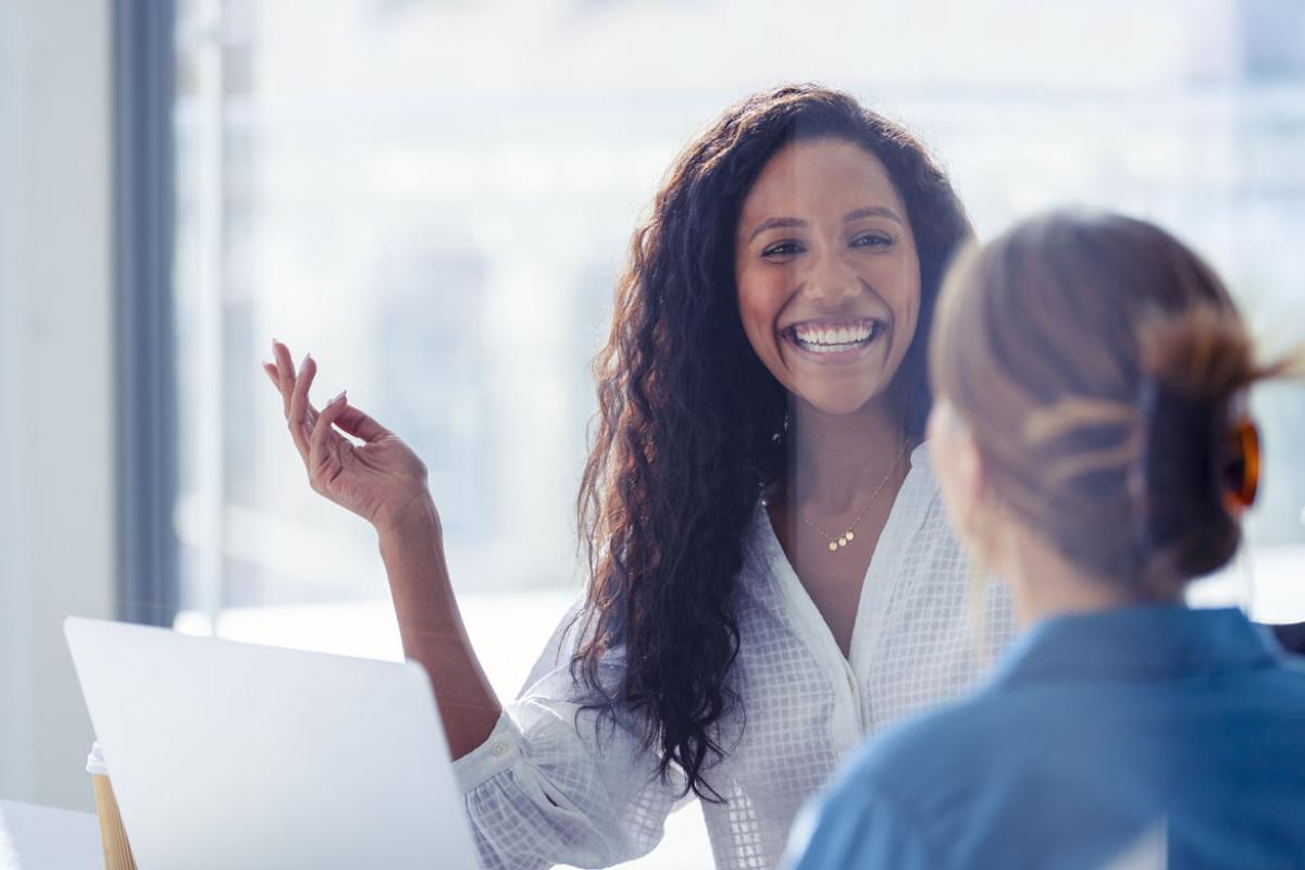 Smiling person in conversation