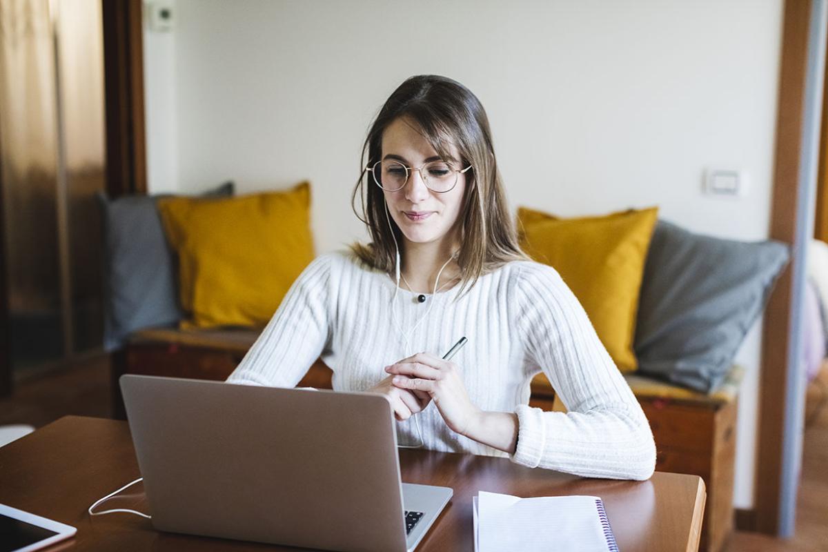 Person sitting in front of a laptop