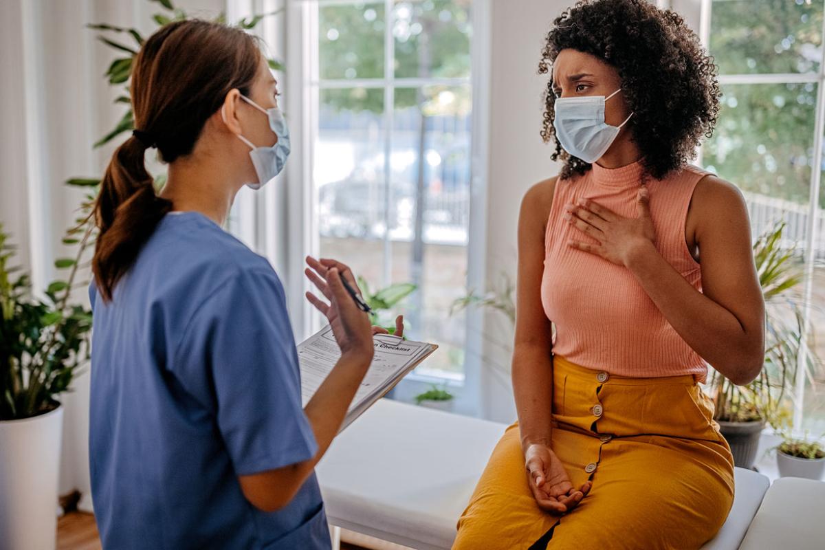 Patient speaking with health care worker