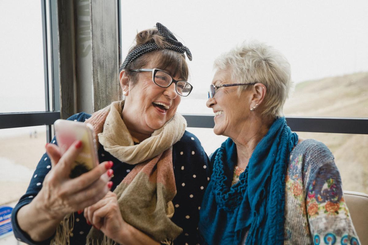 Two people laughing