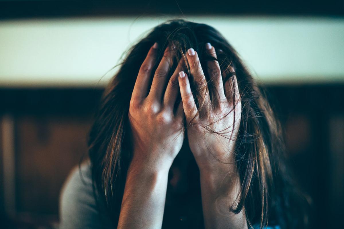 Person with head in hands