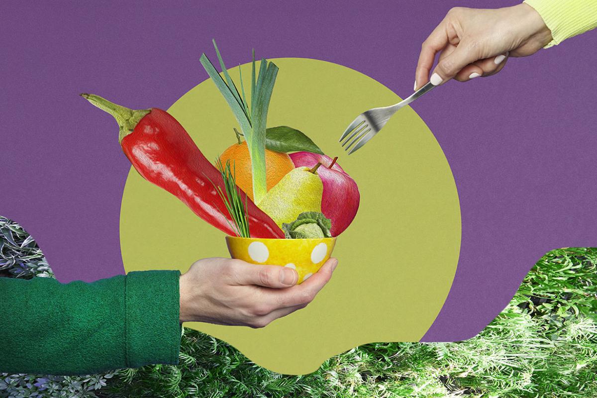 Hand holding vegetables in a bowl