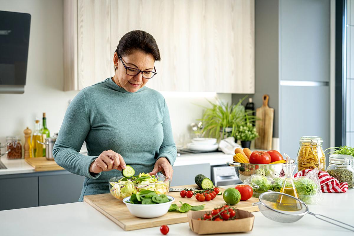 Person preparing a salad