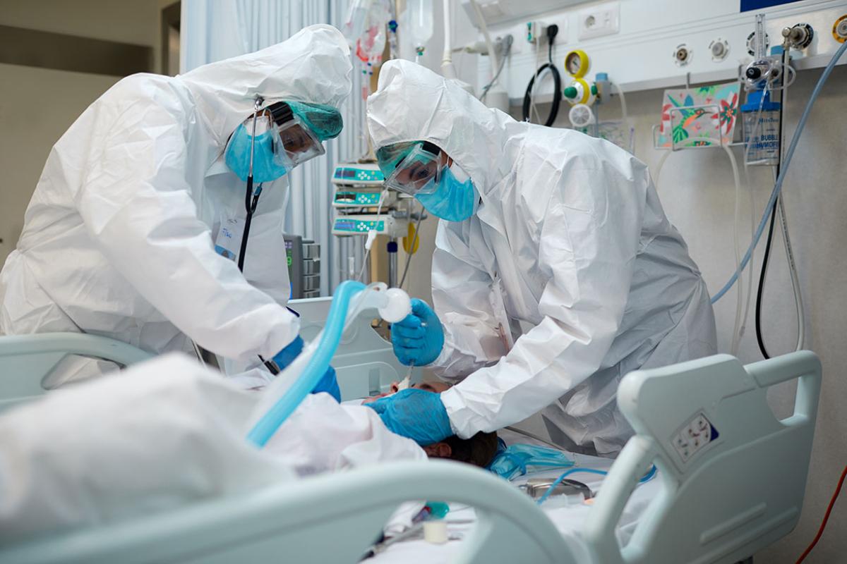 Health care workers intubating a patient