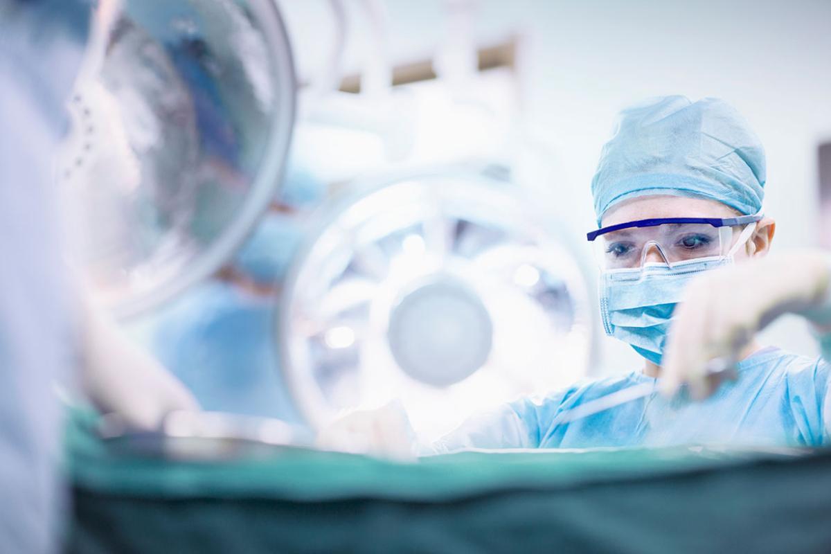 Surgeon performing operation in operating room