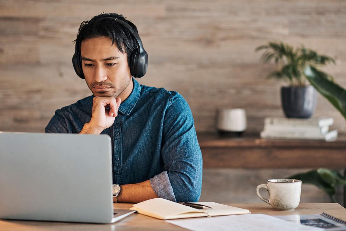 Person working in front of a laptop