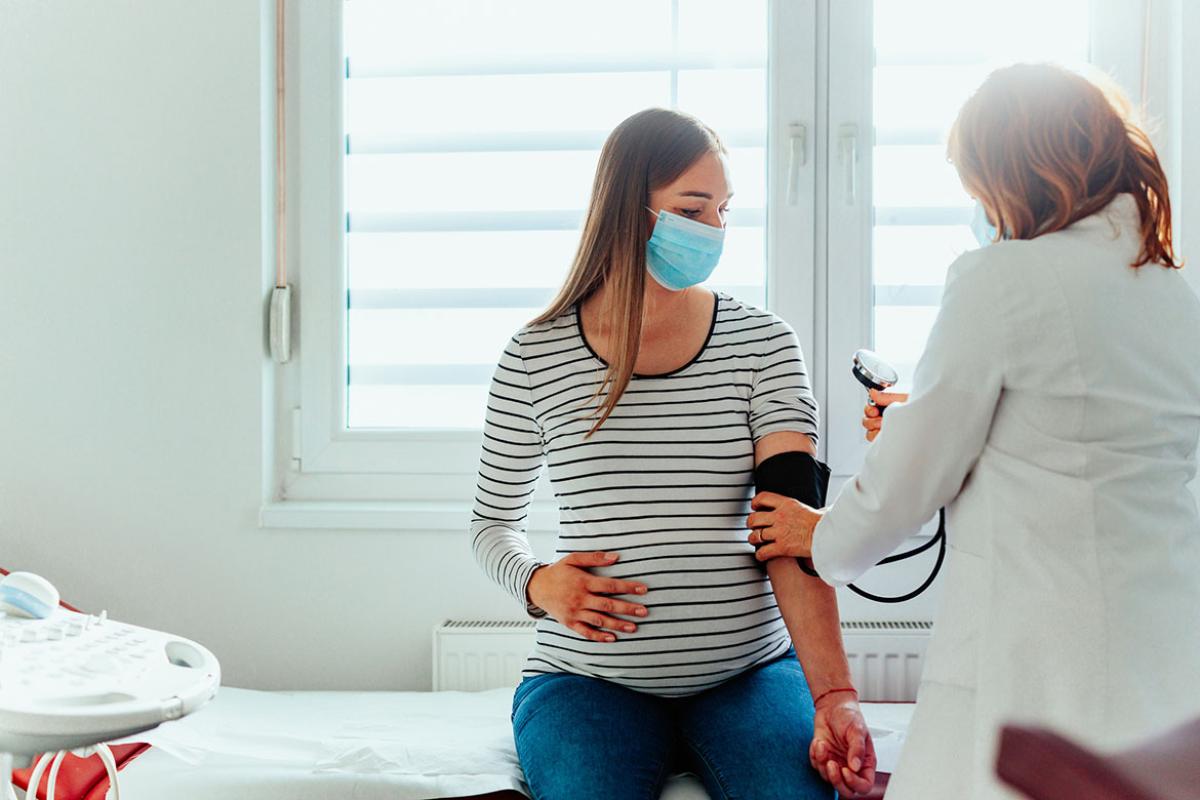 Pregnant patient having blood pressure measured
