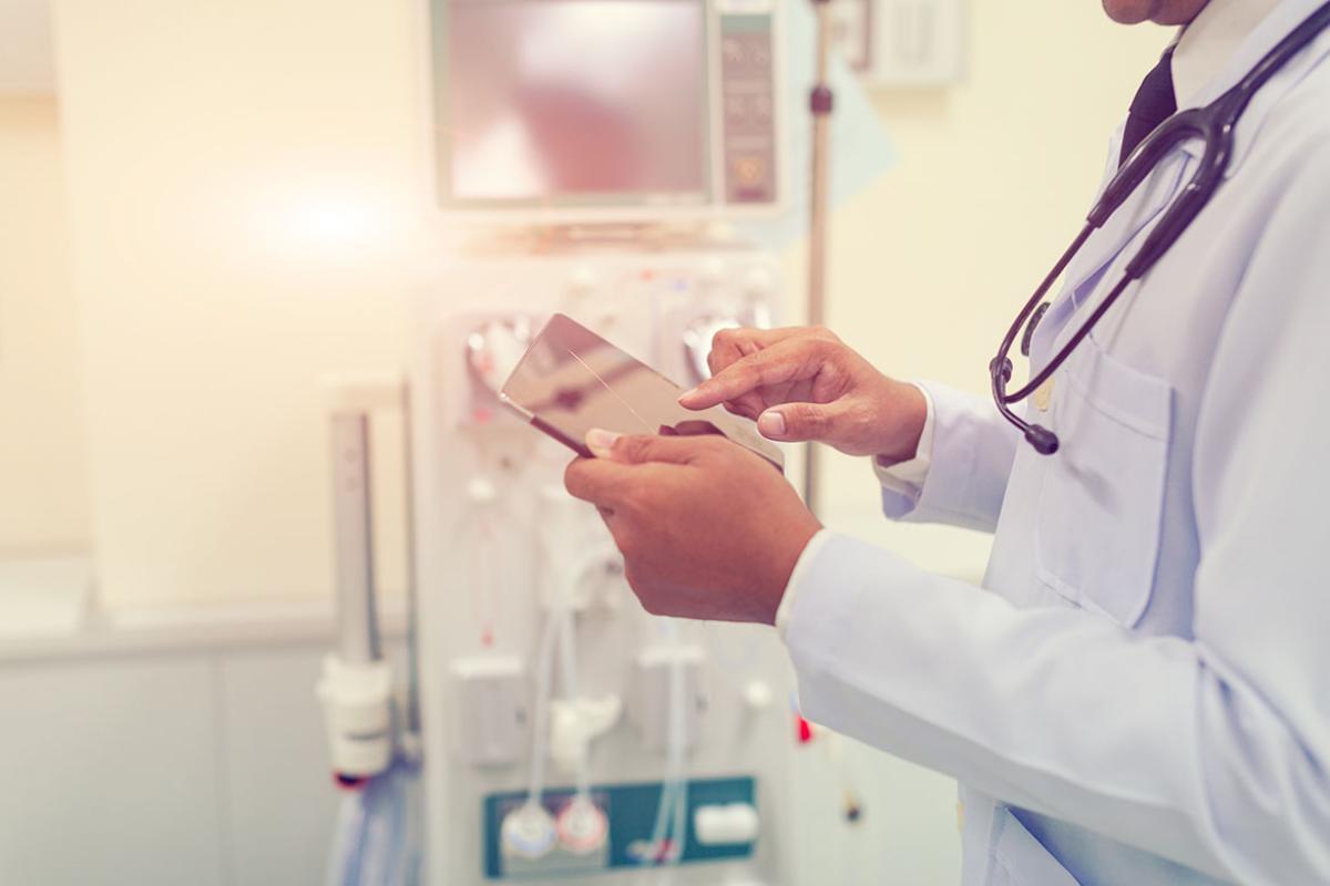 Doctor working with tablet computer
