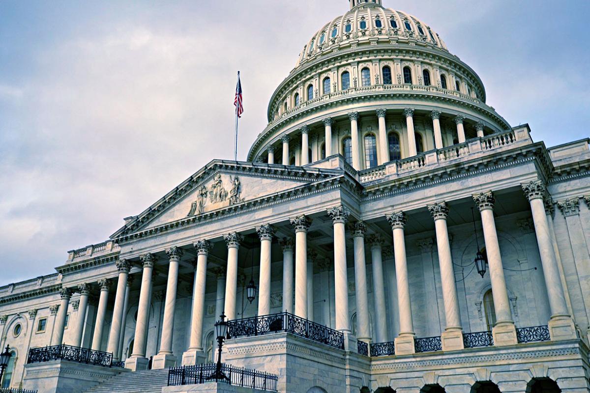 U.S. Capitol dome and columns on cloudy day